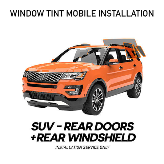 Mobile installation of window tint on a car, showcasing the process and tools used for enhancing vehicle privacy and aesthetics.